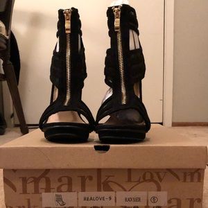 Black heels with gold zipper